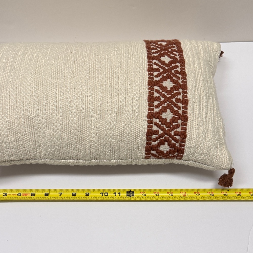 Textured Cream Throw Pillow with Rust Accent and Tassels - Picture 4 of 5